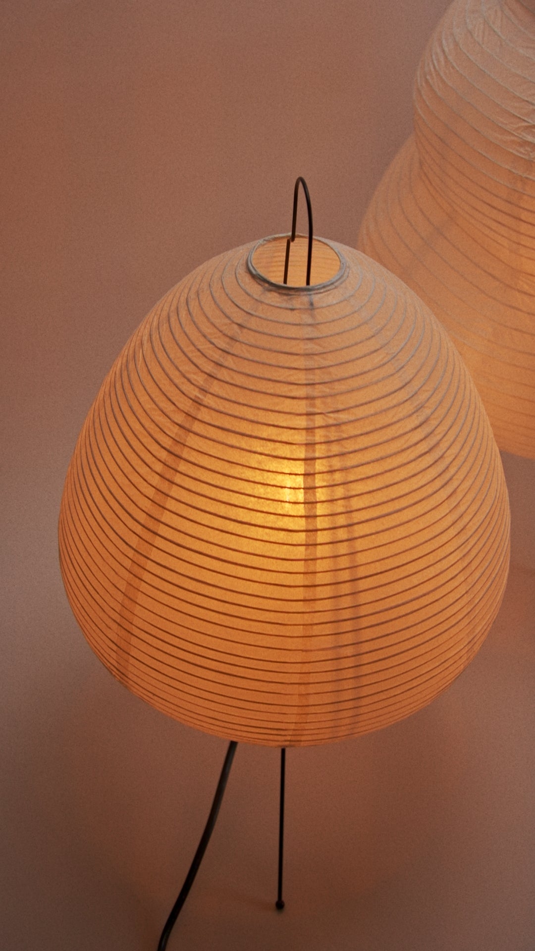 A rice paper lamp glowing warmly