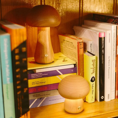 A warm timber japandi lamp glowing softly in a calm room