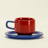 ceramic cup and saucer - red and blue colourway - Dennis Did It