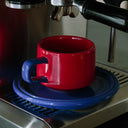 ceramic cup and saucer - red and blue colourway - Dennis Did It